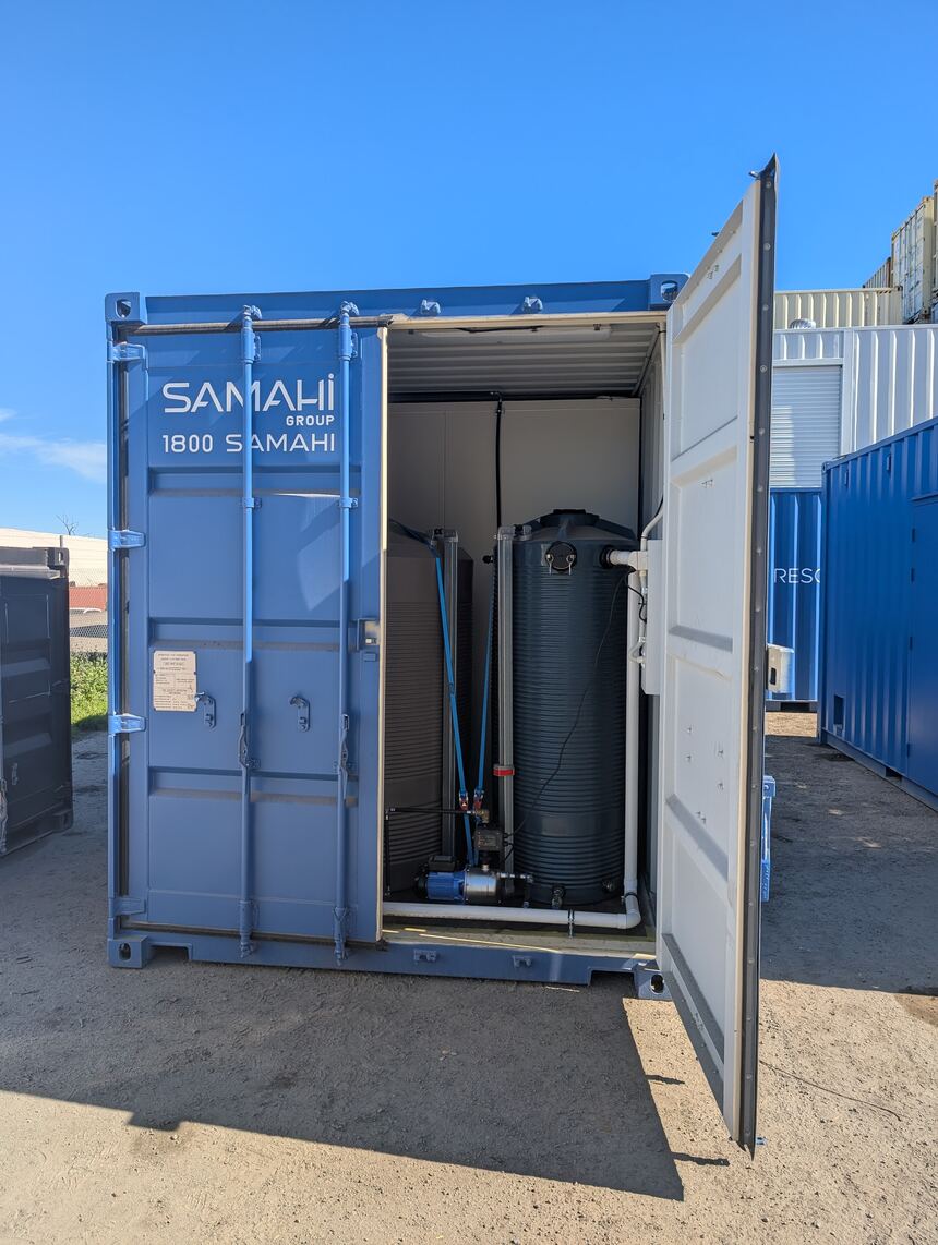 Modified shipping container with Samahi Group vinyl signage, doors open to show the internal fit-out