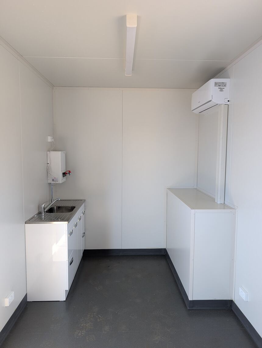 Crib room fit-out with kitchen bench, sink and air conditioning